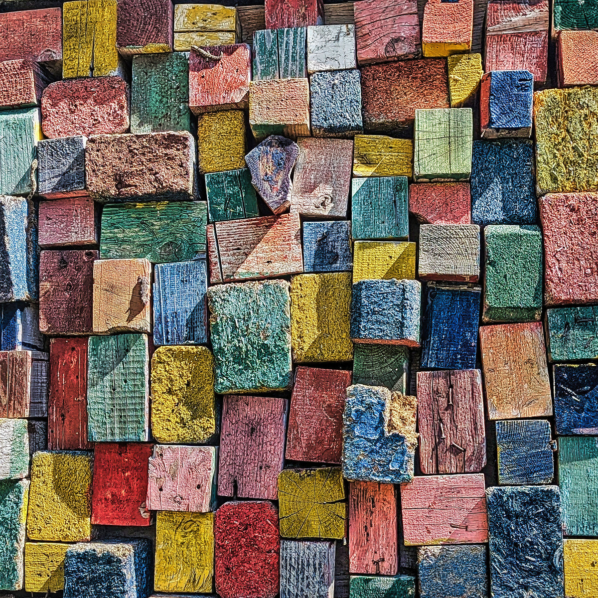 Vibrant Distressed Wood Blocks - A Rustic Charm Captured in Photography by Le Boulanger